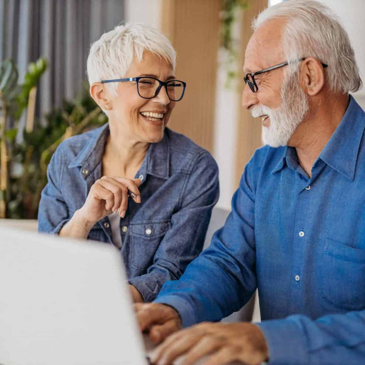 Arlington Precious Metals IRA & Investing Company Copy of Senior couple at laptop smiling GettyImages 1323096524 1200x1200 1